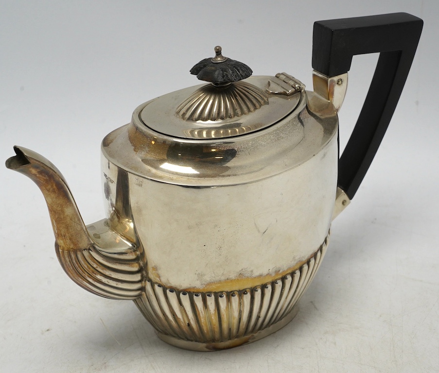 A late Victorian demi-fluted silver oval teapot, by Henry Bourne, Birmingham, 1896, gross weight 11.4oz. Condition - fair